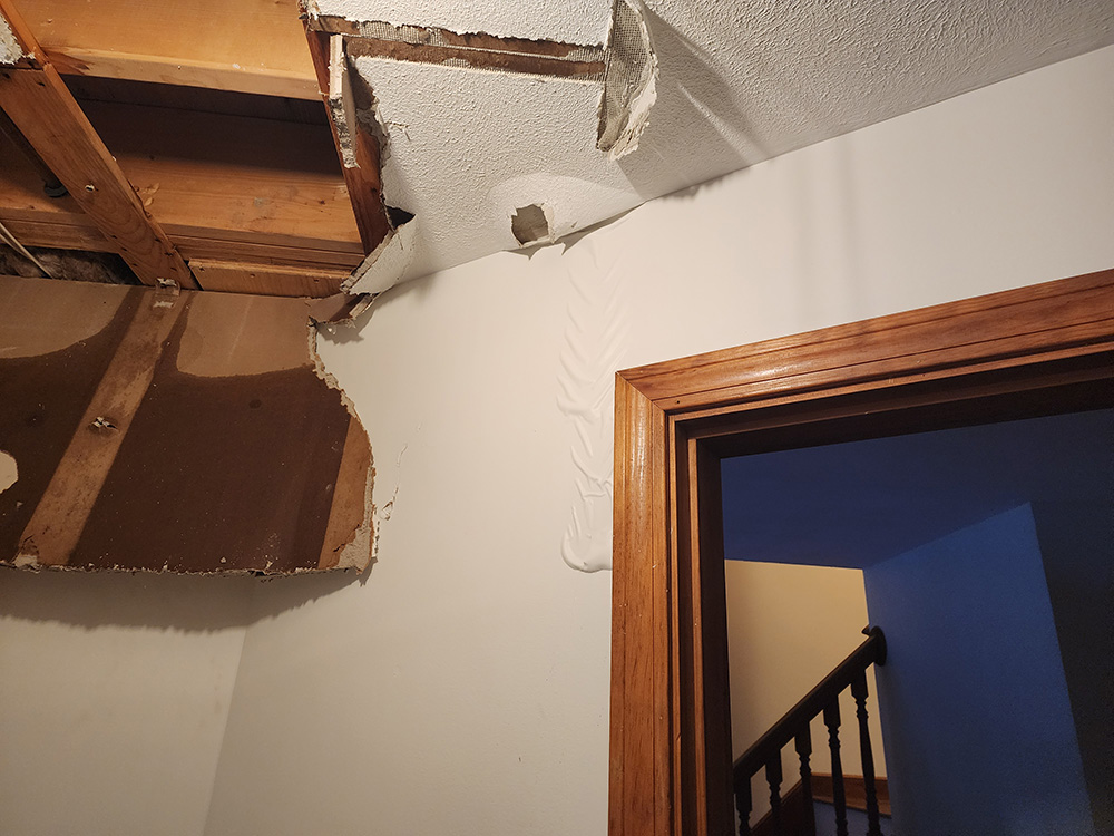 Damaged ceiling and wall caused by water intrusion inside a home